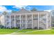Two-story building with multiple units and ample parking at 5804 Longwood Dr. # 203, Murrells Inlet, SC 29576