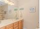 Bathroom with double vanity, mirror, and shower/tub combo at 5804 Longwood Dr. # 203, Murrells Inlet, SC 29576