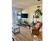 Living room with wicker furniture and large TV at 9580 Shore Dr. # 303, Myrtle Beach, SC 29572