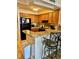Kitchen with wood cabinets and black appliances at 9580 Shore Dr. # 303, Myrtle Beach, SC 29572