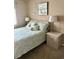 Bedroom with light green bedding and coastal decor at 9580 Shore Dr. # 303, Myrtle Beach, SC 29572