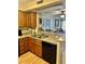 Kitchen with wood cabinets and double sink at 9580 Shore Dr. # 303, Myrtle Beach, SC 29572