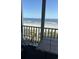 Screened balcony with table and chairs, ocean view at 9580 Shore Dr. # 303, Myrtle Beach, SC 29572
