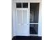 Unit 303 entry with screen door at 9580 Shore Dr. # 303, Myrtle Beach, SC 29572