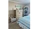 Bedroom with dresser, chair, and striped bedding at 9580 Shore Dr. # 303, Myrtle Beach, SC 29572