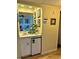 Small wet bar with mini-fridge and mirror at 9580 Shore Dr. # 303, Myrtle Beach, SC 29572