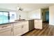 Modern kitchen with granite countertops, white cabinets, and stainless steel appliances at 9661 Shore Dr. # A-38, Myrtle Beach, SC 29572