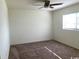 Bright bedroom with ceiling fan and neutral colored carpeting at 9661 Shore Dr. # A-38, Myrtle Beach, SC 29572