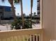 Ocean view from balcony, palm trees, and coastal buildings in the foreground at 9661 Shore Dr. # A-38, Myrtle Beach, SC 29572