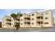 Tan colored building with multiple balconies and parking at 9661 Shore Dr. # A-38, Myrtle Beach, SC 29572