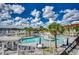 Relaxing community pool area with surrounding patio furniture at 4220 Coquina Harbour Dr. # B-11, Little River, SC 29566