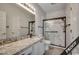 Updated bathroom with granite countertop and a walk-in shower at 4220 Coquina Harbour Dr. # B-11, Little River, SC 29566