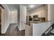 Modern kitchen with granite countertops and stainless steel appliances at 4220 Coquina Harbour Dr. # B-11, Little River, SC 29566