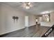 Spacious living room with wood-look floors and ceiling fan at 4220 Coquina Harbour Dr. # B-11, Little River, SC 29566