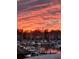 Stunning sunset over the marina, boats, and waterfront community at 4220 Coquina Harbour Dr. # B-11, Little River, SC 29566
