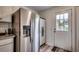 Stainless steel refrigerator and exterior access from kitchen at 829 44Th Ave. N, Myrtle Beach, SC 29577