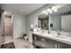 Updated bathroom with double vanity, shower, and modern fixtures at 829 44Th Ave. N, Myrtle Beach, SC 29577