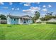Side view of charming light blue house with large lawn at 829 44Th Ave. N, Myrtle Beach, SC 29577