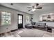 Open living room with L-shaped sectional sofa and hardwood floors at 829 44Th Ave. N, Myrtle Beach, SC 29577