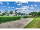 Cute house with a long driveway and green lawn at 829 44Th Ave. N, Myrtle Beach, SC 29577