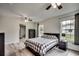 Comfortable bedroom with ceiling fan and a checkered comforter at 829 44Th Ave. N, Myrtle Beach, SC 29577