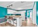 White kitchen with teal walls and breakfast bar at 519 31St Ave. N # 7, Myrtle Beach, SC 29577