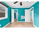 Bright bedroom with teal walls, wood-look floors, and ample closet space at 519 31St Ave. N # 7, Myrtle Beach, SC 29577
