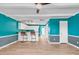 Bright white kitchen with teal walls and a breakfast bar at 519 31St Ave. N # 7, Myrtle Beach, SC 29577