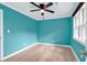 Well-lit bedroom featuring teal walls and light wood flooring at 519 31St Ave. N # 7, Myrtle Beach, SC 29577