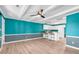 Open living and kitchen area with teal walls at 519 31St Ave. N # 7, Myrtle Beach, SC 29577