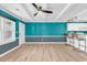 Open living and kitchen area with teal walls at 519 31St Ave. N # 7, Myrtle Beach, SC 29577