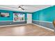 Living room with teal walls and light wood floors at 519 31St Ave. N # 7, Myrtle Beach, SC 29577