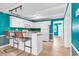 White kitchen with teal walls and breakfast bar at 519 31St Ave. N # 7, Myrtle Beach, SC 29577