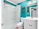 Bathroom with white vanity, glass shower, and teal walls at 519 31St Ave. N # 7, Myrtle Beach, SC 29577