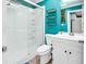 Clean bathroom with white vanity, glass shower, and teal accents at 519 31St Ave. N # 7, Myrtle Beach, SC 29577