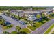 Exterior view of building with parking lot and street at 5601 N Ocean Blvd. # C-202, Myrtle Beach, SC 29577