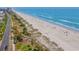Aerial view of beach, road, and buildings at 5601 N Ocean Blvd. # C-202, Myrtle Beach, SC 29577