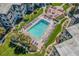 Aerial view of community pool with surrounding lounge chairs at 5601 N Ocean Blvd. # C-202, Myrtle Beach, SC 29577