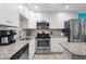 Modern kitchen with stainless steel appliances and granite countertops at 5601 N Ocean Blvd. # C-202, Myrtle Beach, SC 29577