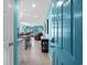 Inviting entryway with teal walls, tile flooring, and a view into the living area at 5601 N Ocean Blvd. # C-202, Myrtle Beach, SC 29577