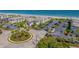 Aerial view of coastal community with oceanfront location, parking, and lush landscaping at 5601 N Ocean Blvd. # C-202, Myrtle Beach, SC 29577