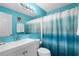 Bathroom with shower/tub combo, white vanity, and blue accents at 5601 N Ocean Blvd. # C-202, Myrtle Beach, SC 29577