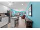Kitchen with island, stainless steel appliances, and blue walls at 5601 N Ocean Blvd. # C-202, Myrtle Beach, SC 29577