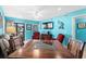 Bright dining area with wood table and four chairs, located near living room at 5601 N Ocean Blvd. # C-202, Myrtle Beach, SC 29577