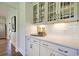 Butlers pantry with glass-front cabinets and quartz countertop at 173 Azure Loop, Myrtle Beach, SC 29588