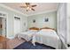 Bedroom with two twin beds, ceiling fan and ample natural light at 132 N Waccamaw Dr., Murrells Inlet, SC 29576