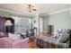 Ocean view living room with hardwood floors, comfortable seating and access to balcony at 132 N Waccamaw Dr., Murrells Inlet, SC 29576