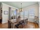 Ocean view dining room with long wooden table and seating for eight at 132 N Waccamaw Dr., Murrells Inlet, SC 29576