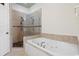 Spa-like bathroom with a large soaking tub and a walk-in shower at 132 N Waccamaw Dr., Murrells Inlet, SC 29576