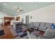 Open living space with sectional sofa, hardwood floors, and kitchen views at 132 N Waccamaw Dr., Murrells Inlet, SC 29576